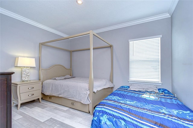 bedroom featuring light wood-type flooring, crown molding, and a textured ceiling