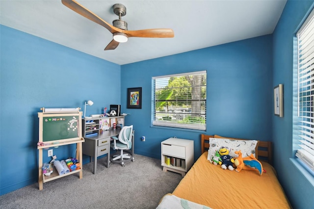 bedroom with ceiling fan and carpet