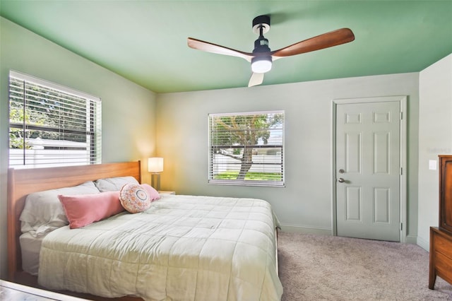 carpeted bedroom featuring ceiling fan