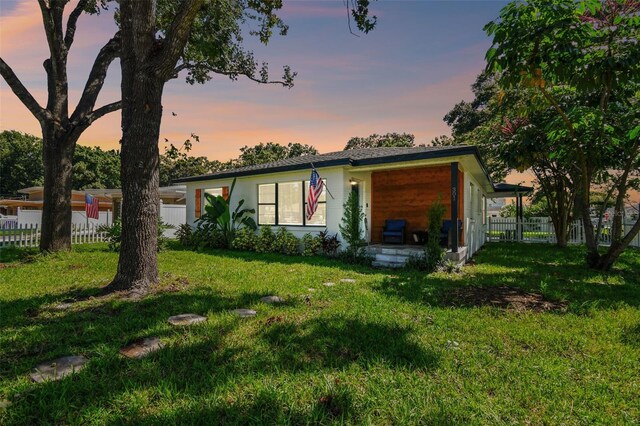 view of front of property with a lawn