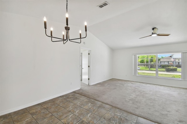 carpeted empty room with ceiling fan with notable chandelier and vaulted ceiling