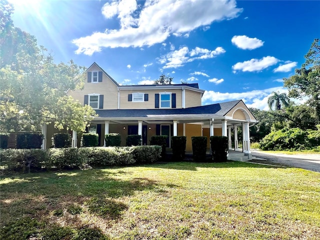 view of front of home featuring a front lawn and a porch