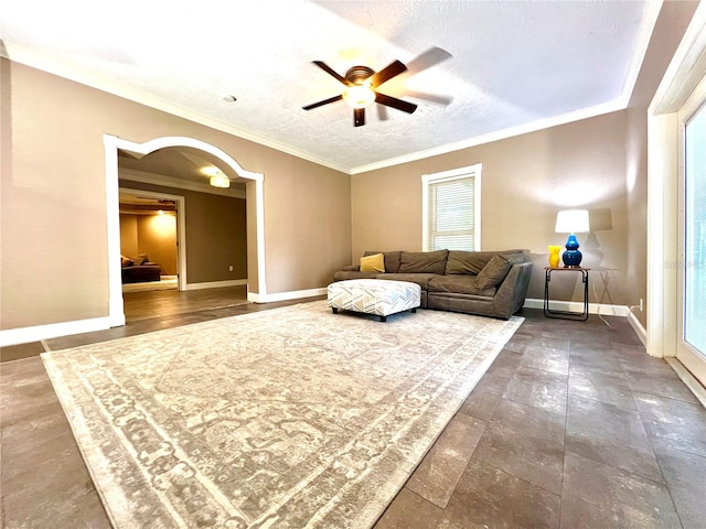 living room with crown molding, a textured ceiling, a healthy amount of sunlight, and ceiling fan