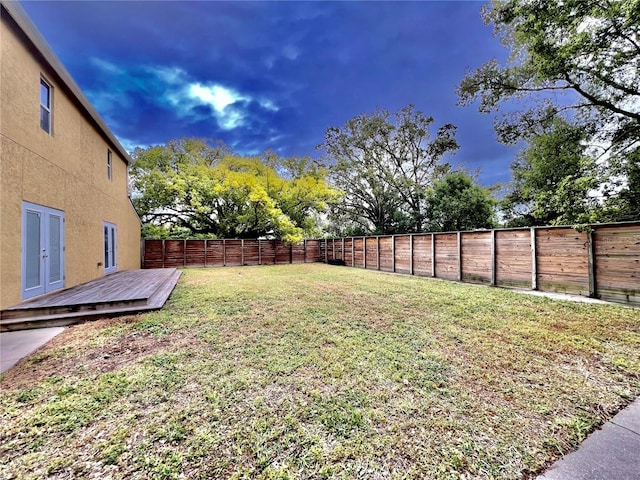 view of yard featuring a wooden deck