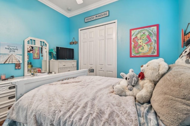 bedroom with ornamental molding and a closet