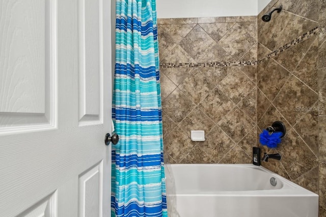 bathroom with shower / tub combo