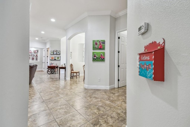 hallway featuring crown molding and tile patterned floors