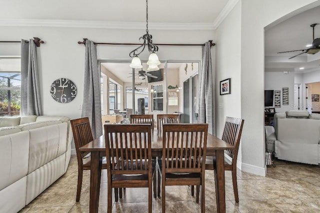 dining space with ornamental molding, plenty of natural light, and ceiling fan