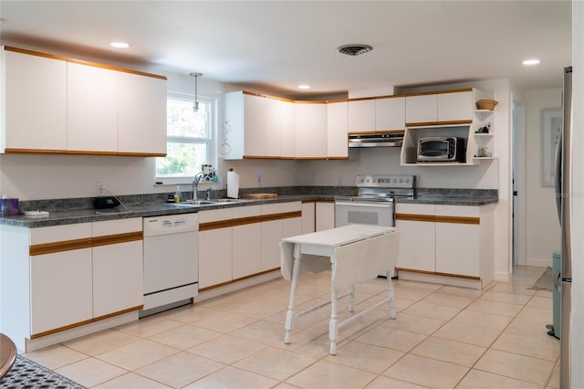 kitchen featuring stainless steel electric range oven, hanging light fixtures, dishwasher, white cabinetry, and sink