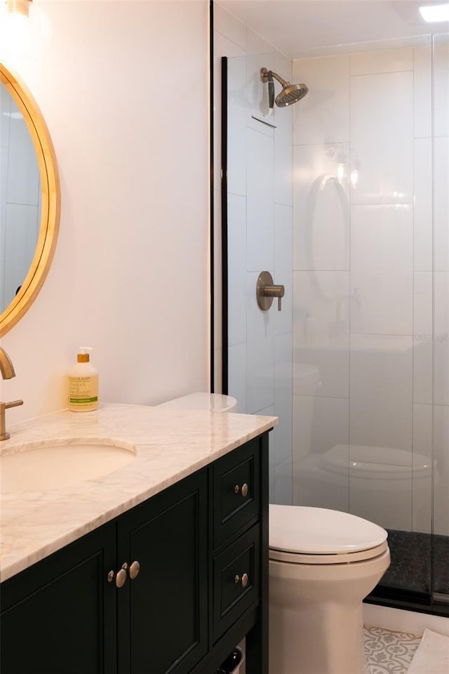 bathroom featuring walk in shower, toilet, and vanity