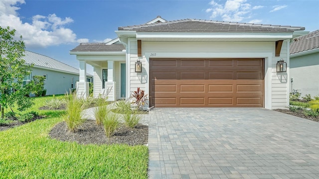 ranch-style home featuring a garage