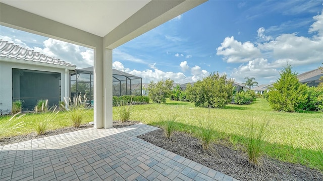 view of patio / terrace featuring a lanai