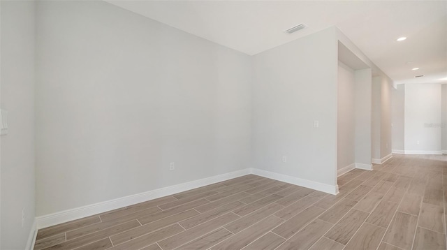 spare room featuring light hardwood / wood-style floors