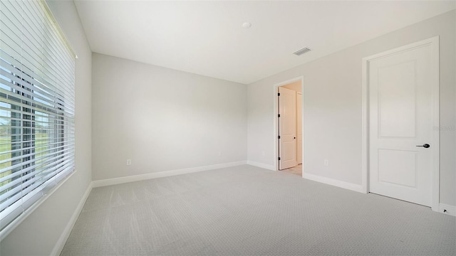 unfurnished bedroom with light carpet