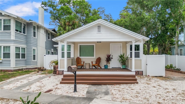 back of property with a wooden deck