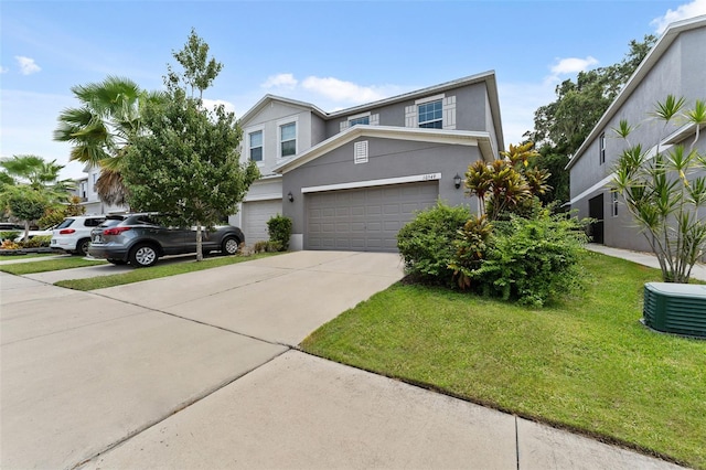 view of front of property with a garage and a front lawn