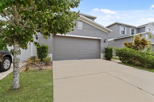 view of front facade with a garage and a front yard