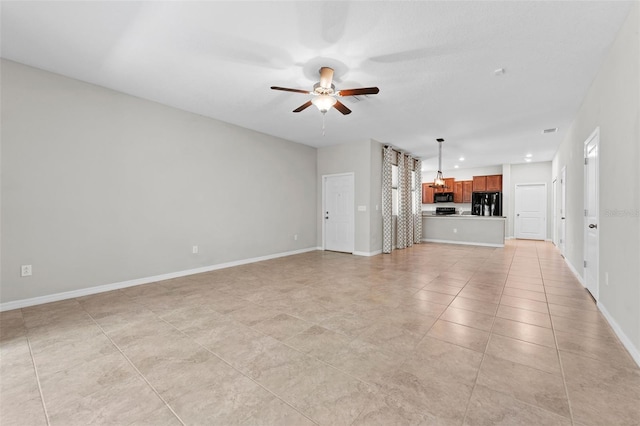 unfurnished living room featuring ceiling fan and light tile patterned floors