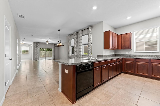 kitchen with light tile patterned floors, sink, ceiling fan, hanging light fixtures, and black dishwasher