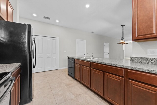 kitchen featuring decorative light fixtures, dishwasher, stainless steel electric range oven, light tile patterned floors, and sink