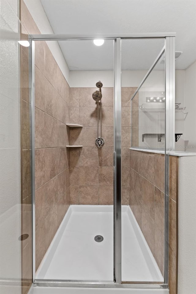 bathroom featuring an enclosed shower