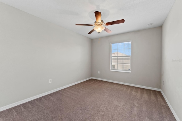 unfurnished room with carpet flooring and ceiling fan