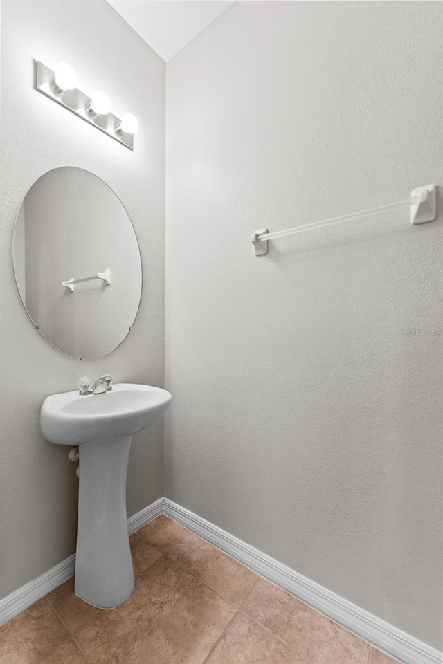 bathroom with tile patterned flooring