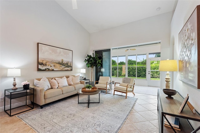 living room with light tile patterned floors and high vaulted ceiling