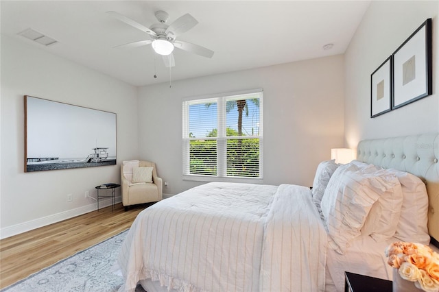 bedroom featuring ceiling fan and light hardwood / wood-style flooring