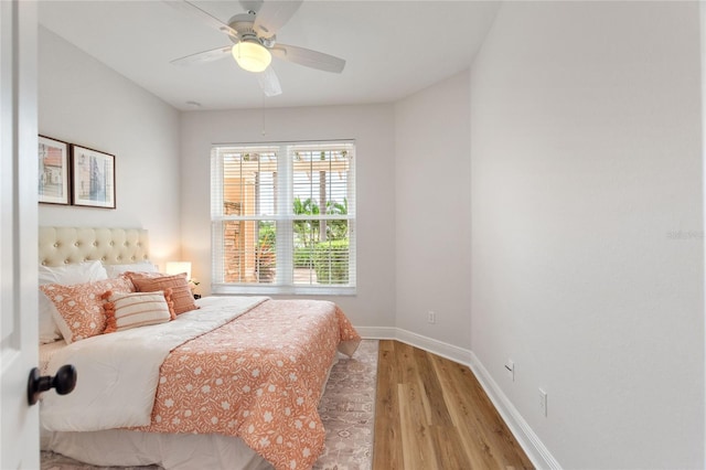 bedroom featuring ceiling fan and light hardwood / wood-style flooring