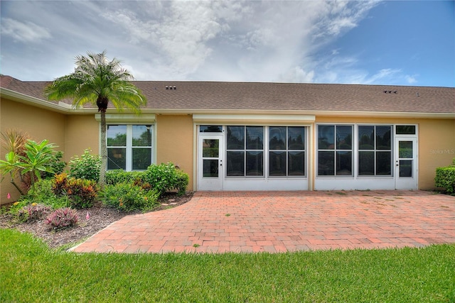 rear view of house with a patio