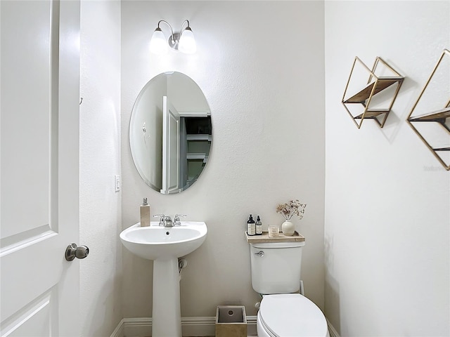 bathroom featuring sink and toilet