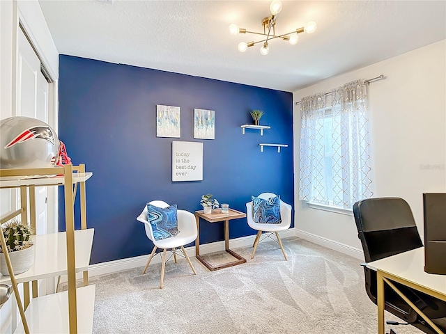 carpeted home office featuring plenty of natural light and an inviting chandelier