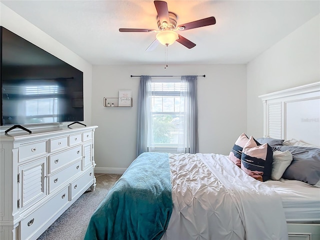 bedroom with light carpet and ceiling fan