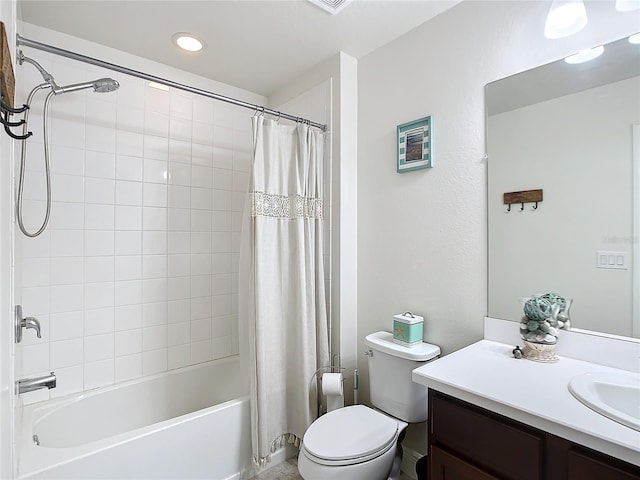 full bathroom with toilet, vanity, and shower / tub combo with curtain