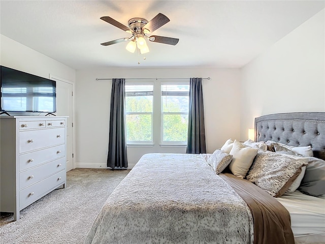 bedroom featuring ceiling fan and light colored carpet