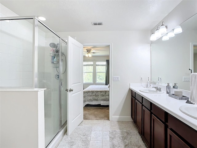 bathroom with ceiling fan, an enclosed shower, and vanity