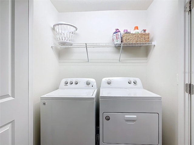 laundry room featuring washer and clothes dryer