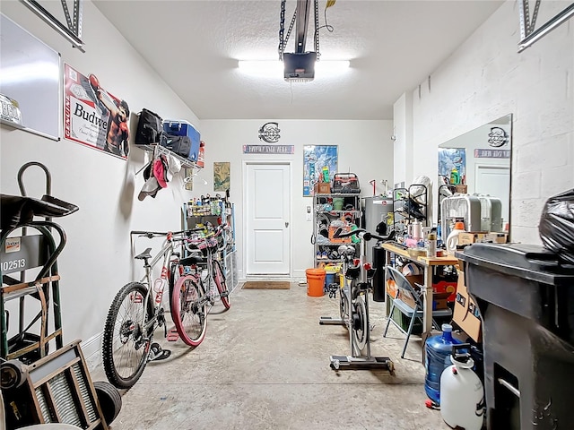 garage with a workshop area and a garage door opener