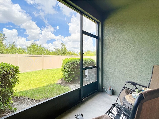 unfurnished sunroom featuring cooling unit