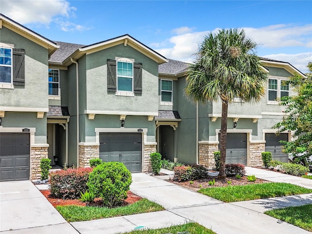 townhome / multi-family property featuring a garage