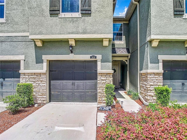 view of exterior entry with a garage