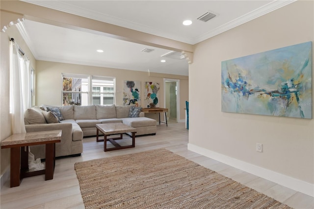 living room with light hardwood / wood-style flooring and ornamental molding