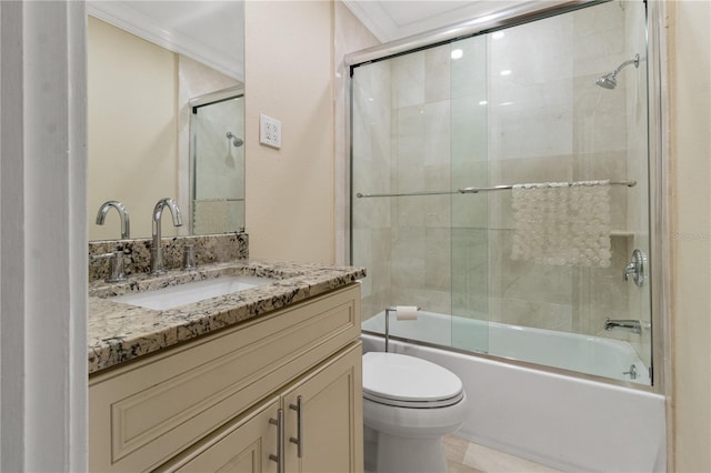 full bathroom featuring vanity, bath / shower combo with glass door, tile patterned flooring, toilet, and ornamental molding