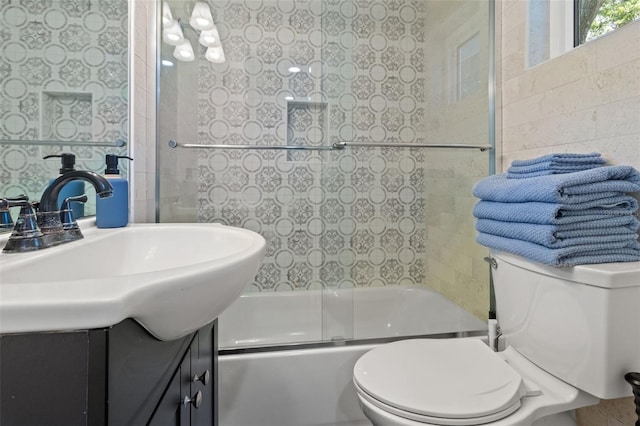 full bathroom featuring vanity, toilet, and enclosed tub / shower combo