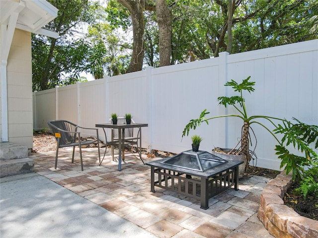 view of patio / terrace featuring a fire pit