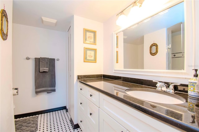 bathroom featuring tile patterned floors and vanity