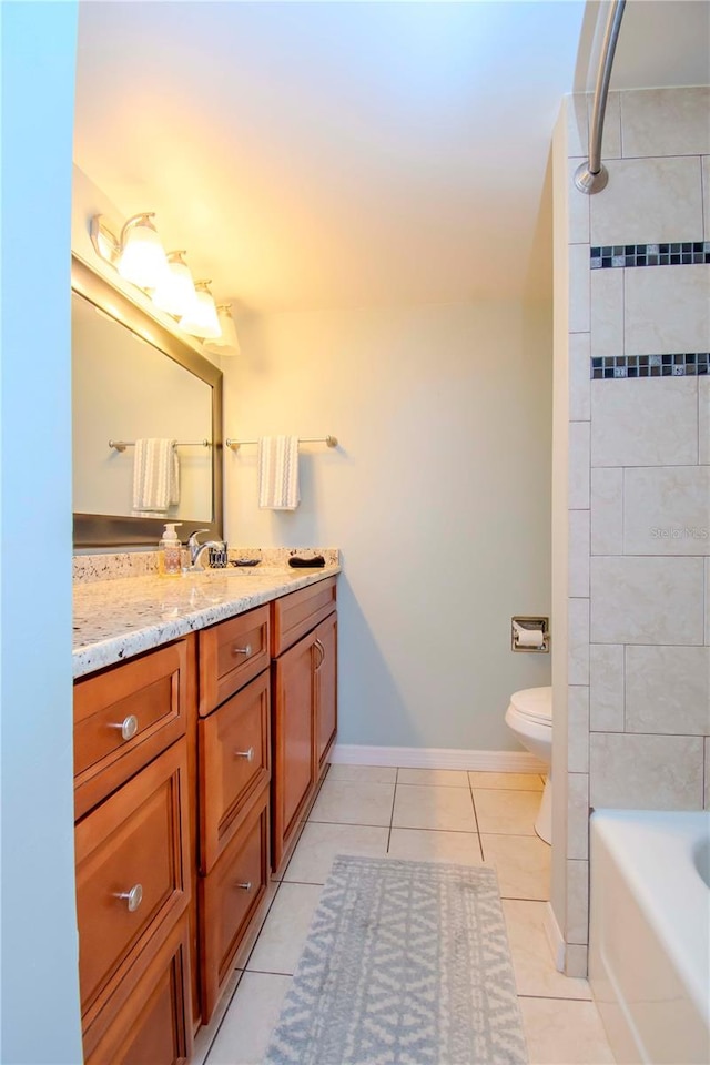 full bathroom featuring vanity, toilet, tile patterned floors, and tiled shower / bath