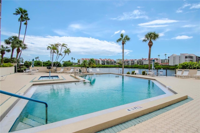 view of swimming pool with a patio area