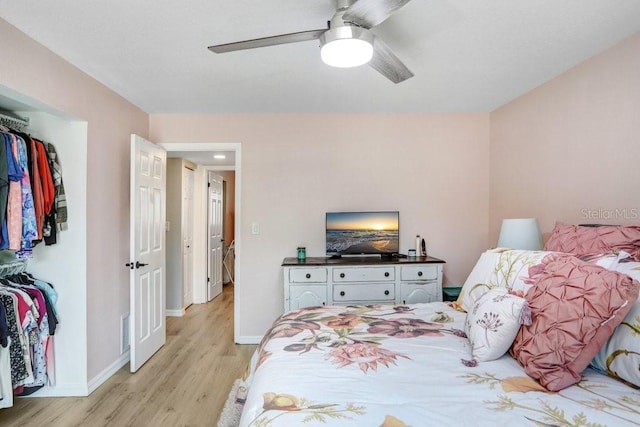 bedroom with ceiling fan and light wood-type flooring